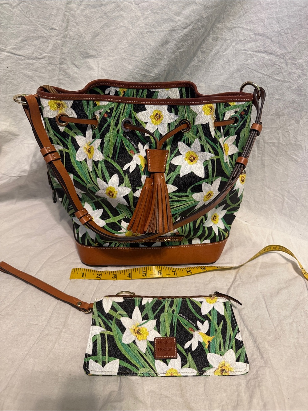 Dooney & Bourke Black Floral Drawstring Bucket Bag with Brown Trim